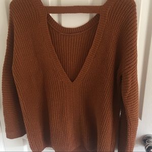 Rust colored loose fitting v-back knit sweater